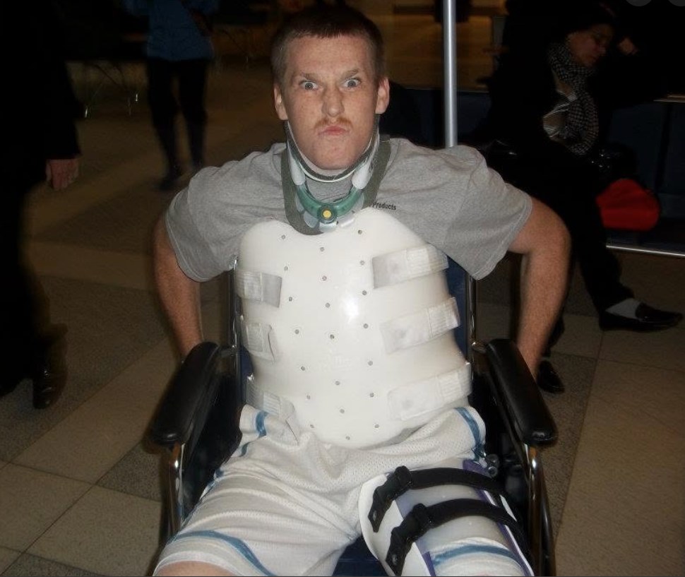 Michael Reichert on the day he left the hospital, raising his arms in triumph